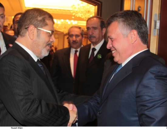 الملك ومرسي يؤكدان ضرورة إيجاد مخرج سريع للأزمة السورية ( صور )